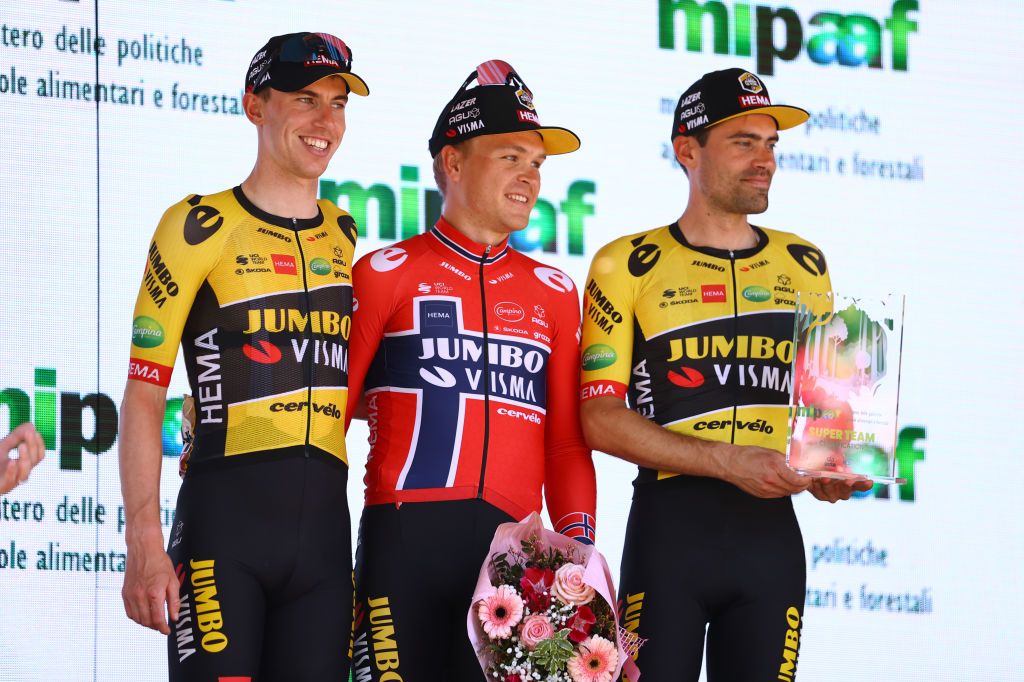 REGGIO EMILIA ITALY MAY 18 LR Pascal Eenkhoorn of Netherlands Tobias Foss of Norway and Tom Dumoulin of Netherlands and Team Jumbo Visma celebrate at podium as best team prize winner during the 105th Giro dItalia 2022 Stage 11 a 203km stage from Santarcangelo di Romagna to Reggio Emilia Giro WorldTour on May 18 2022 in Reggio Emilia Italy Photo by Michael SteeleGetty Images