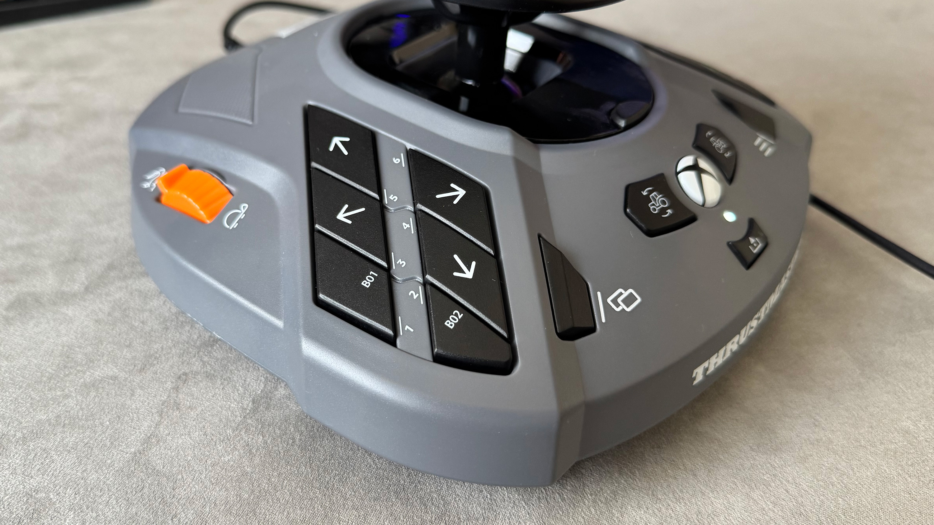 The Thrustmaster SimTask Farmstick on a desk