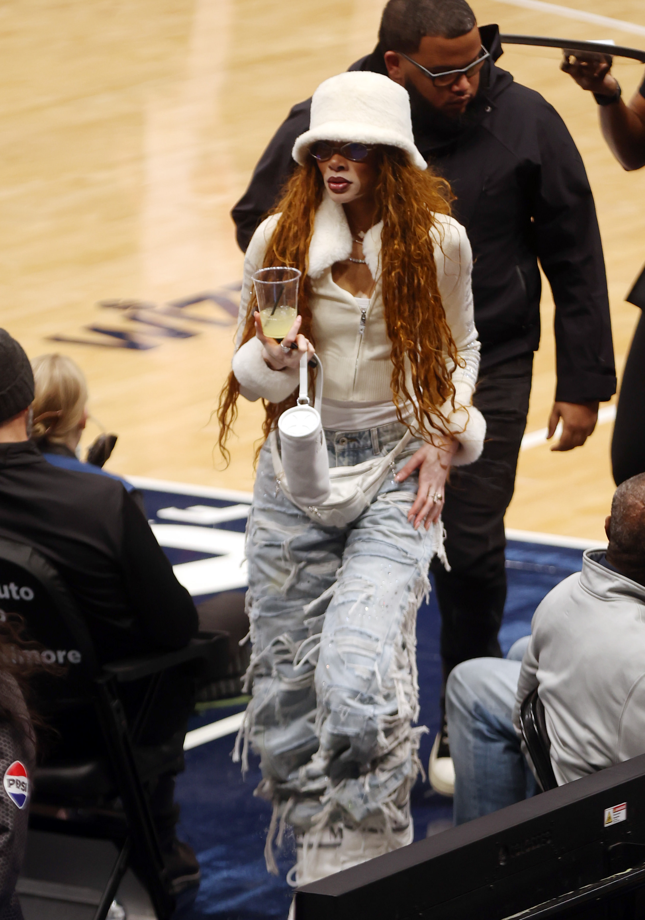 Winnie Harlow at an NBA game.