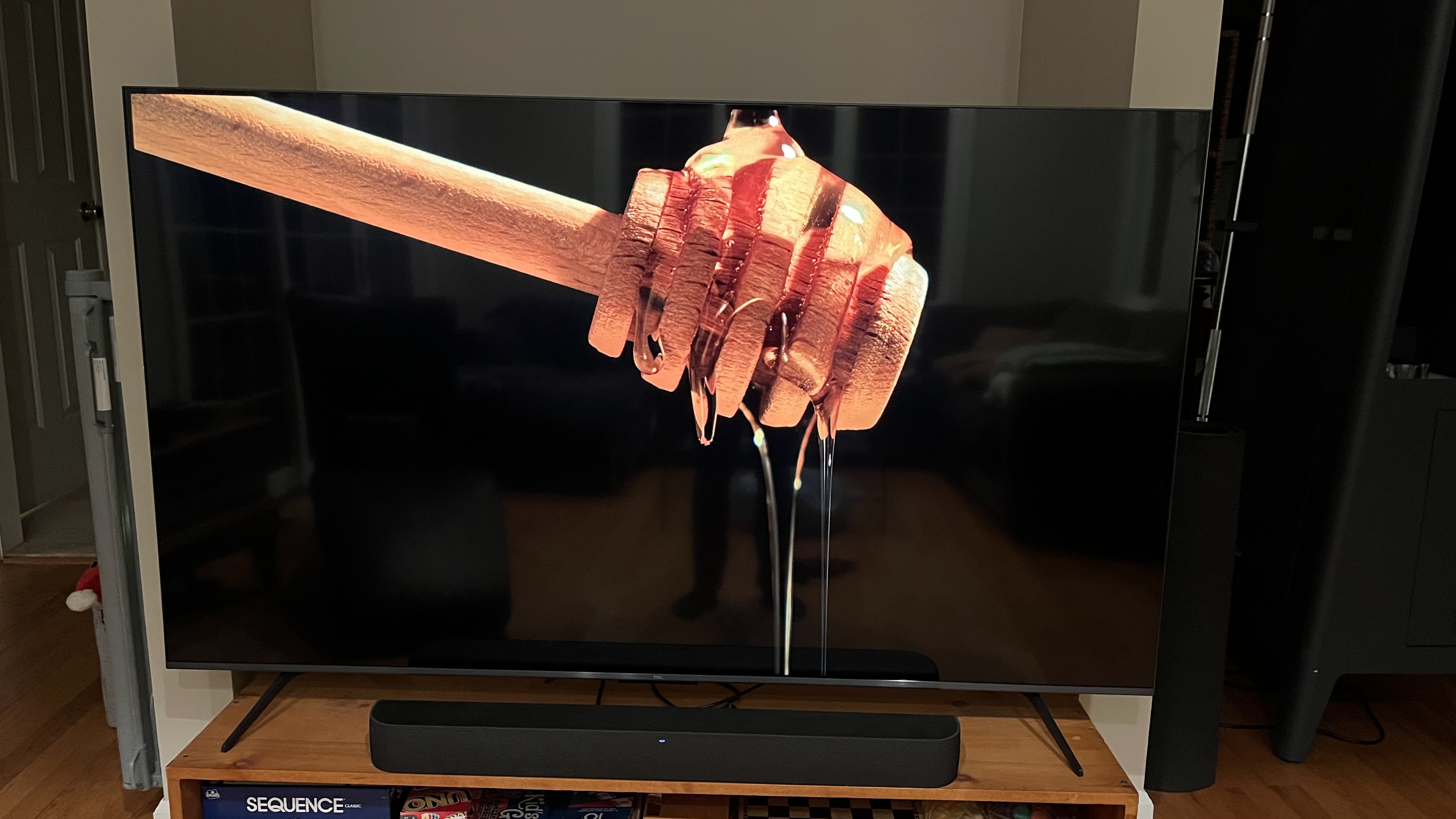 TCL QM6K showing image of honey dripping