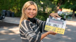 Hayley Kiyoko with Girls Like Girls movie slate on the set of Girls Like Girls