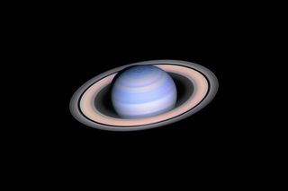 László Francsics captured the near infrared colors of Saturn using a combination of red and infrared planetary filters. He used a T1 ASA 1000mm Ritchey-Chretien reflecting telescope at f/16, Baader R, IR 685, IR 742, Alt-Azimuth fork mouth, ASI 174mm camera, R-IR composite, multiple stacked exposure. 