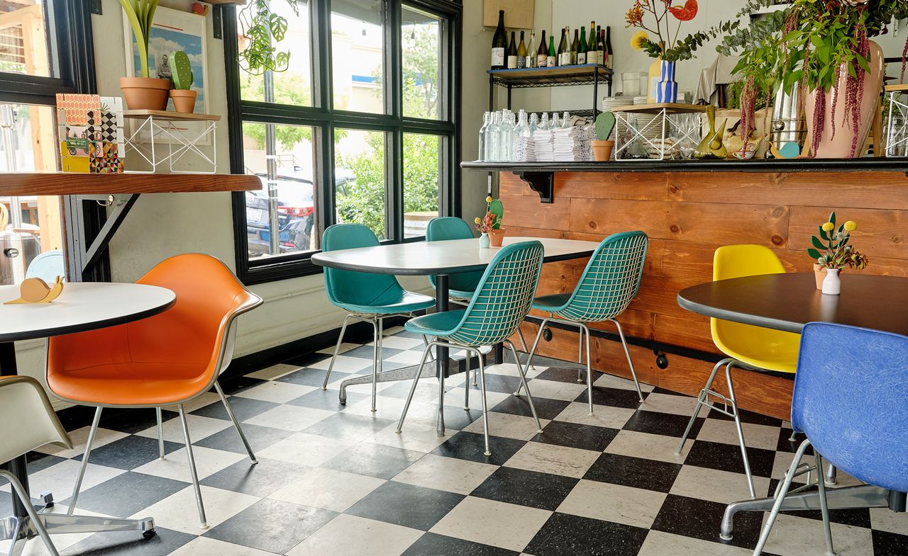 tables in cafe on black and white floor at Oakland&#039;s Snail Bar