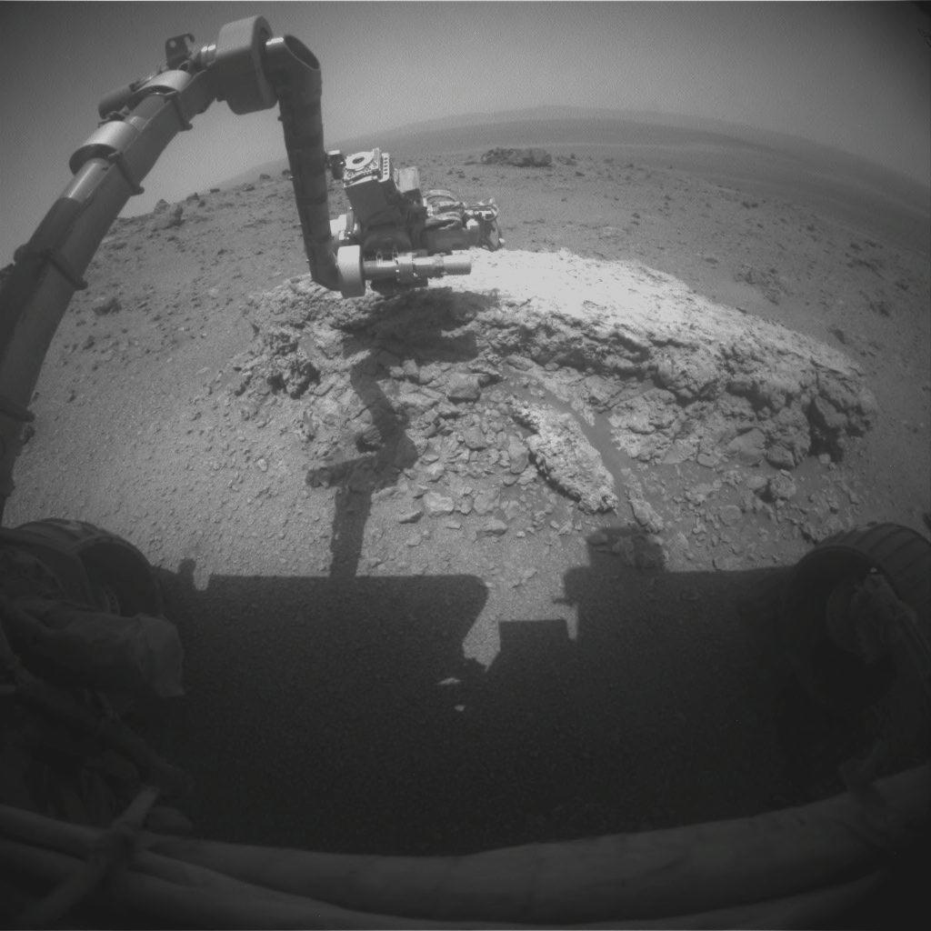 This image shows the Mars rover Opportunity&#039;s robotic arm reaching out to the rock Tilsdale 2 at the huge crater Endeavour on the Martian surface on Aug. 23, 2011.