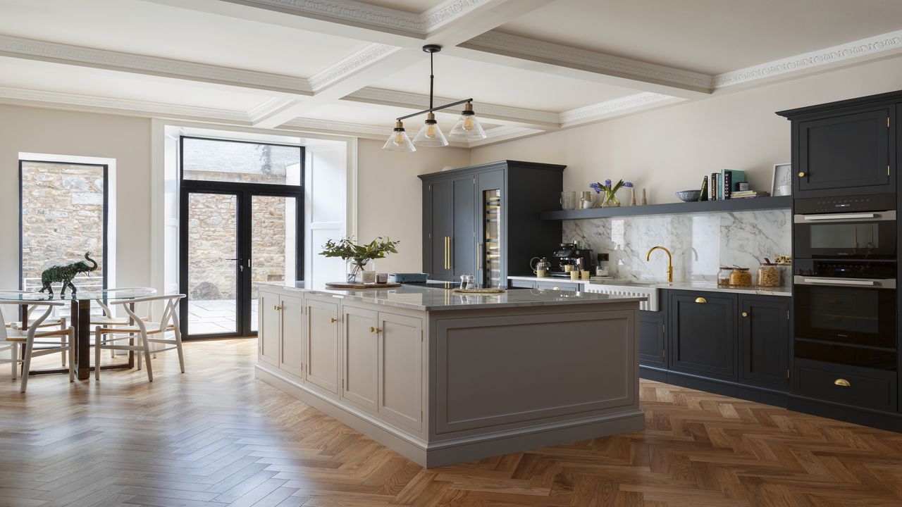 Basement kitchen ideas with grey kitchen island and navy blue shaker cabinets