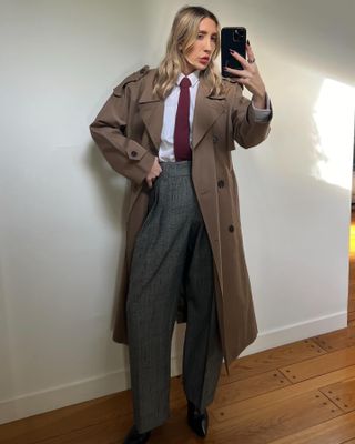 Influencer wearing a tie and trench coat