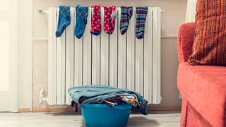Is condensation on windows bad? Image shows socks drying on a radiator