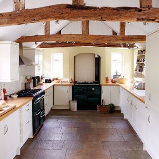 farmhouse exterior kitchen with shaker units and beams