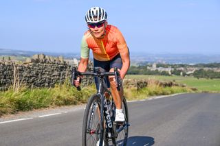 female cyclist rides in the drops