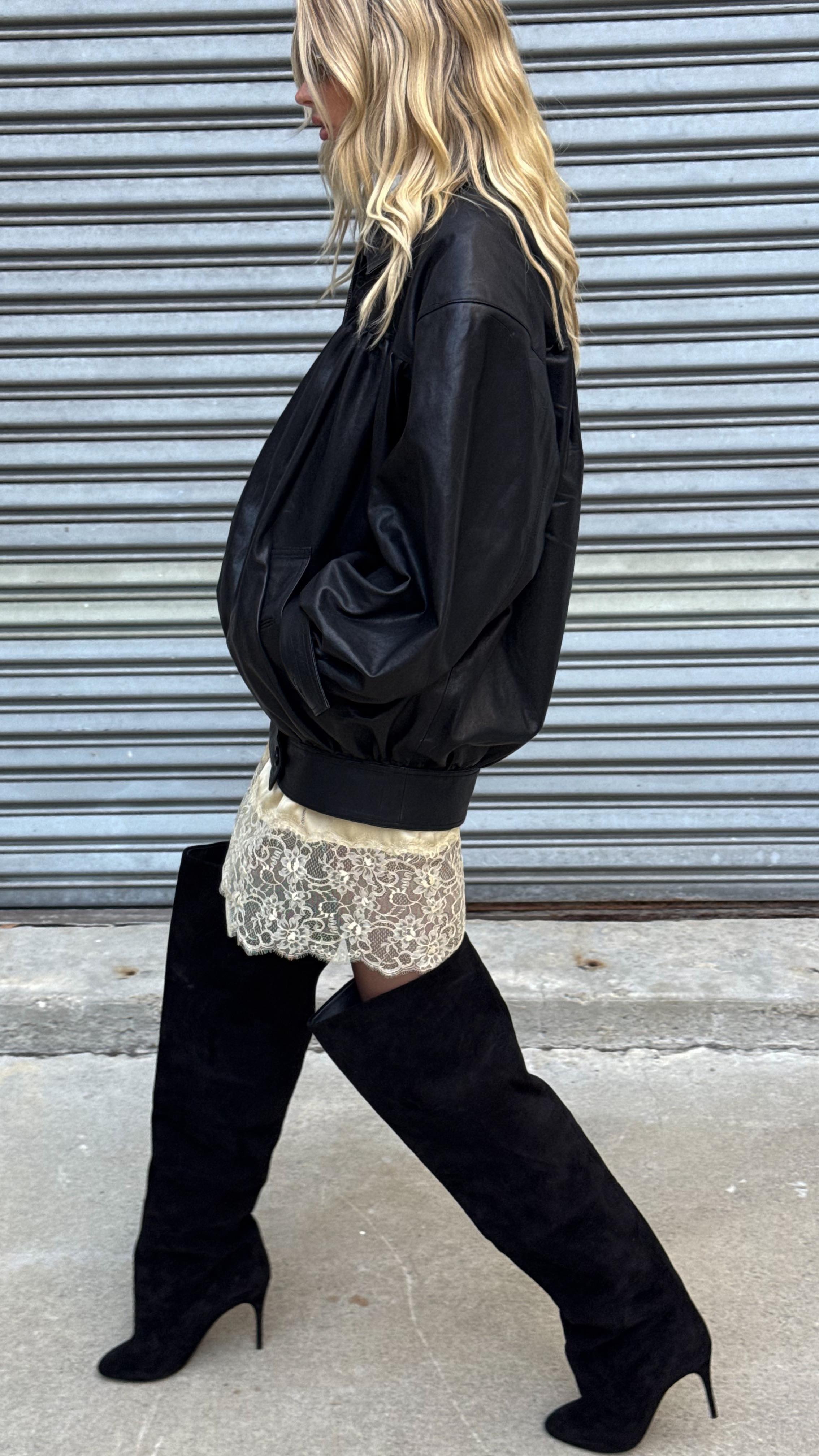 Elsa Hosk wears lace trim skirt fall trend outfit.