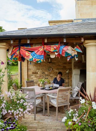 alfresco dining area with fabric canopy