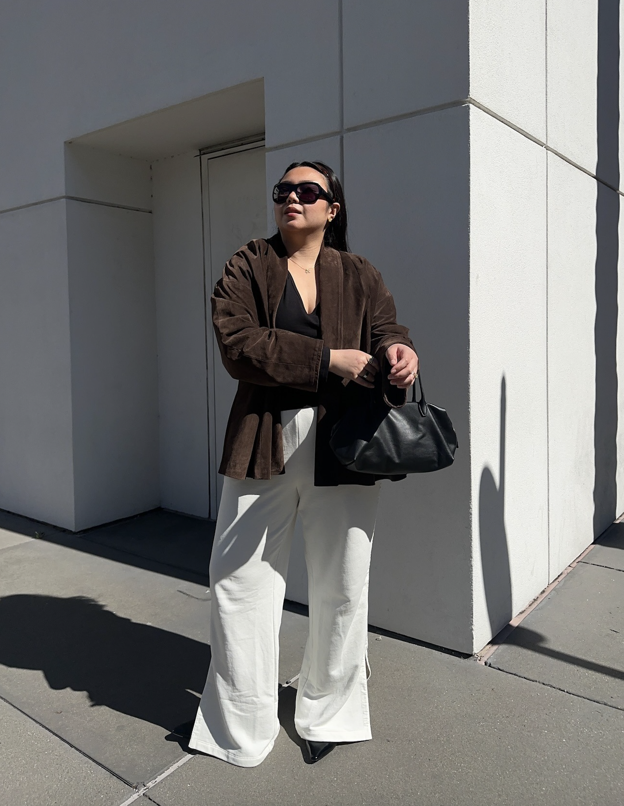 Marina wearing the COS bowling bag