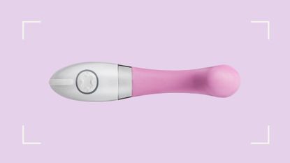 Pink vibrator with white handle on a light pink background