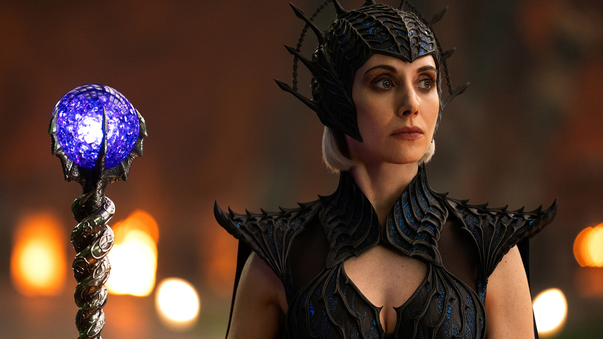 Alison Brie's Evil Lyn holding her staff and looking at someone standing off-camera in 2026's He-Man and the Masters of the Universe film