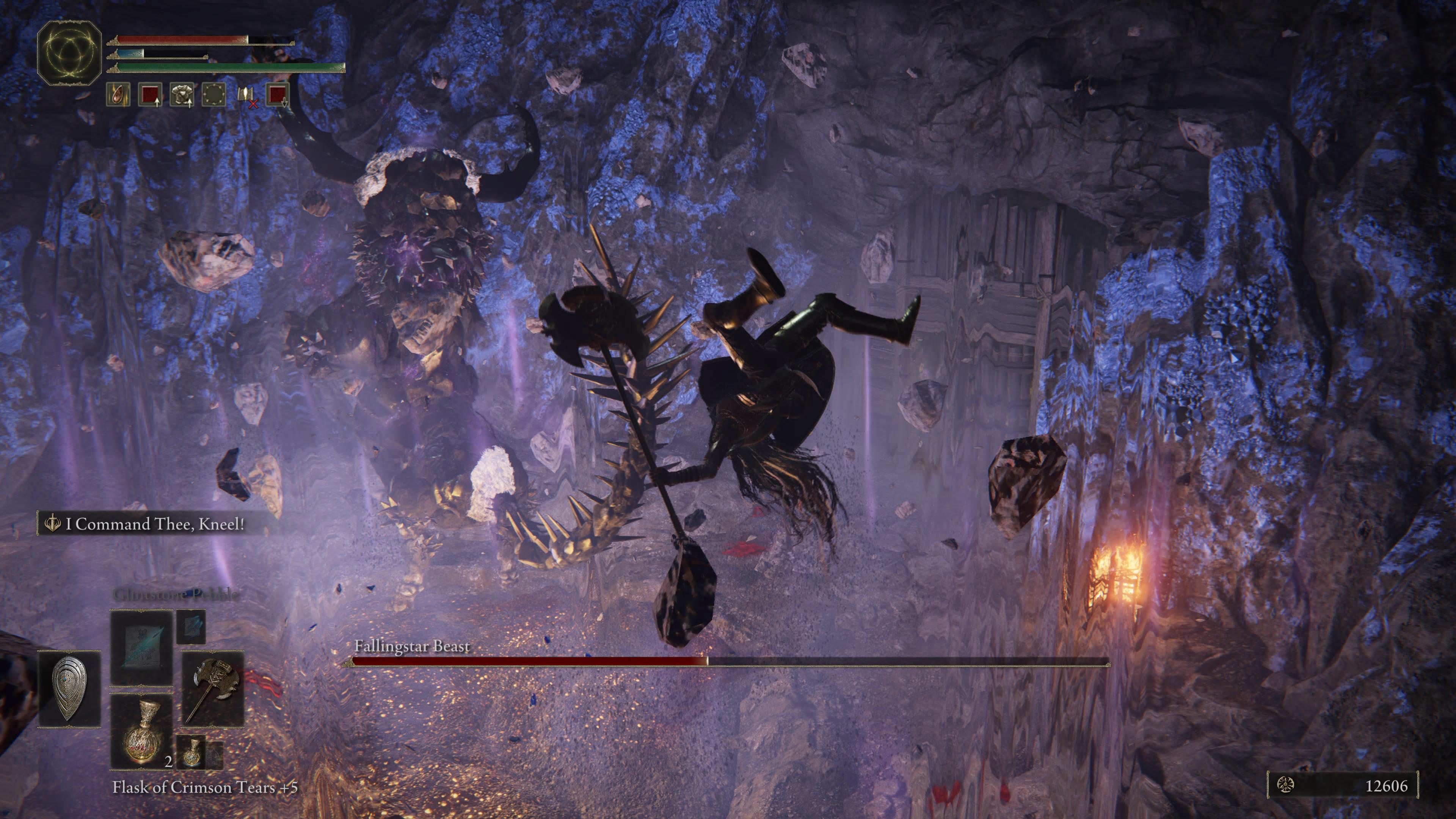 A Falling Star Beast uses gravity magic to fling the player into the air in Elden Ring as the boss arena glows blue