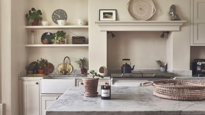 A neutral kitchen with a concealed range hood