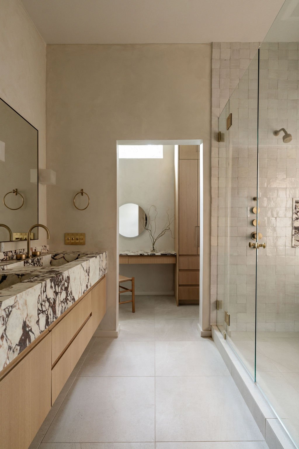 marble sink bathroom with walk in shower