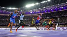 PARIS, FRANCE - AUGUST 04: Noah Lyles of Team United States crosses the finish line to win the gold medal in the Men's 100m Final on day nine of the Olympic Games Paris 2024 at Stade de France on August 04, 2024 in Paris, France. (Photo by Cameron Spencer/Getty Images)