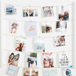 A hanging photo holder with pictures on it