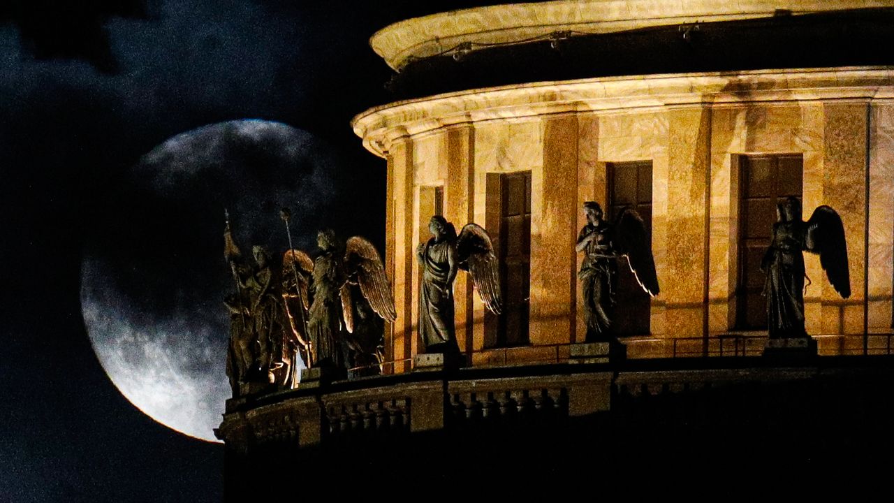 The full moon shines over St. Isaac's Cathedral in St. Petersburg, Russia 21, on Aug. 21, 2021.