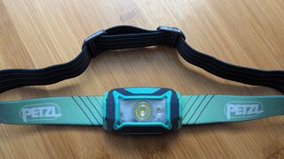 Petzl Tikka Core on a wooden table