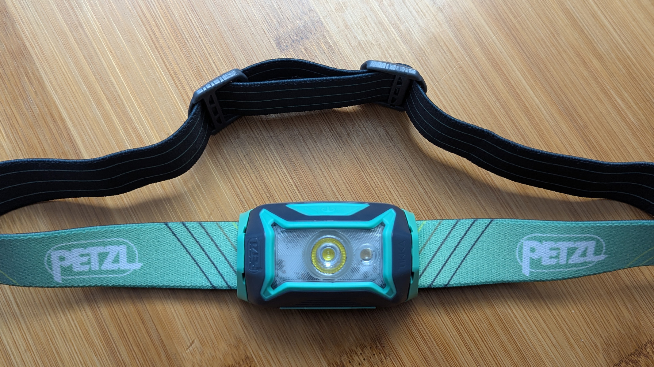 Petzl Tikka Core on a wooden table