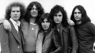 The Ian Gillan Band posing for a photograph in 1977