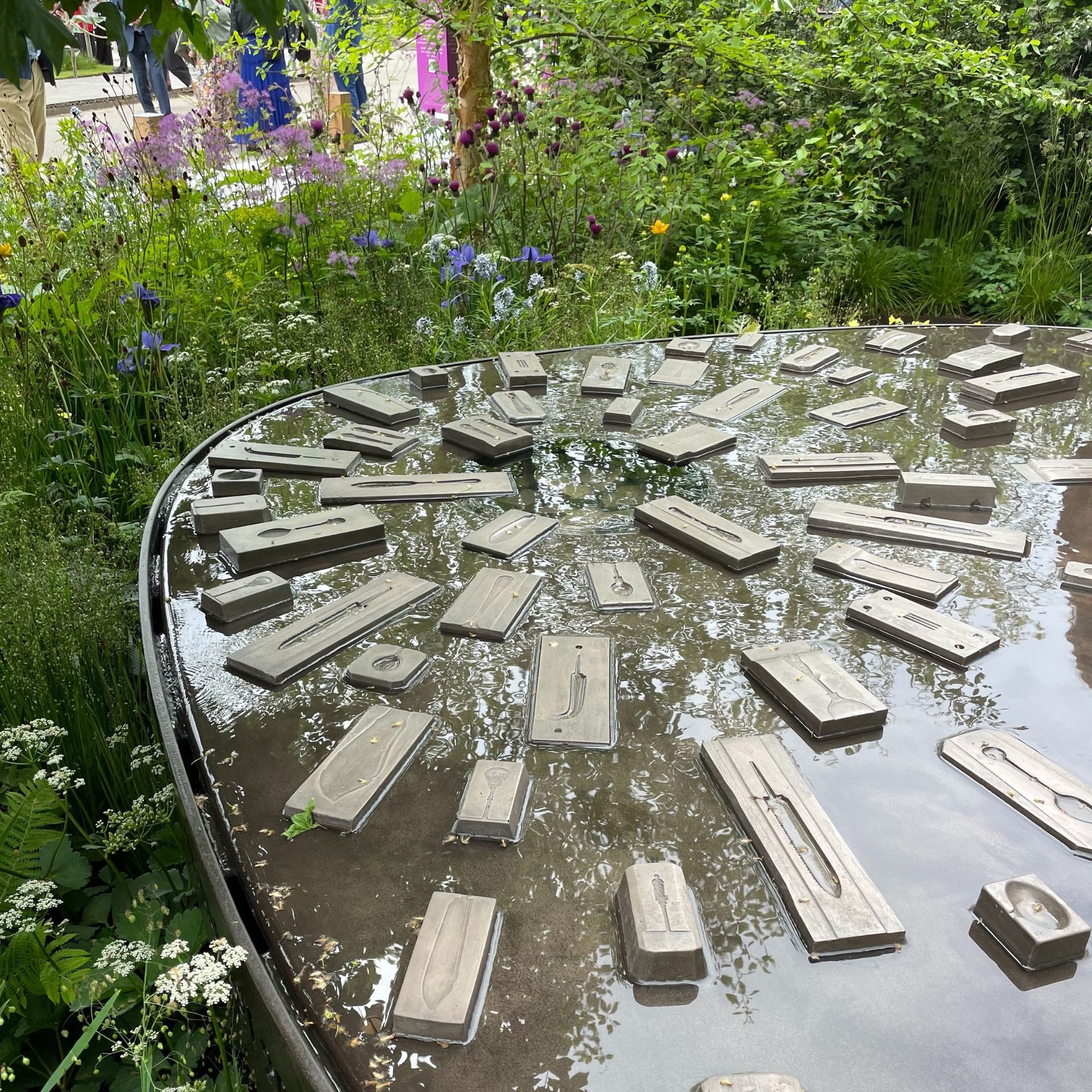 A raised pond surrounded by wildflowers at the RHS Chelsea Flower Show