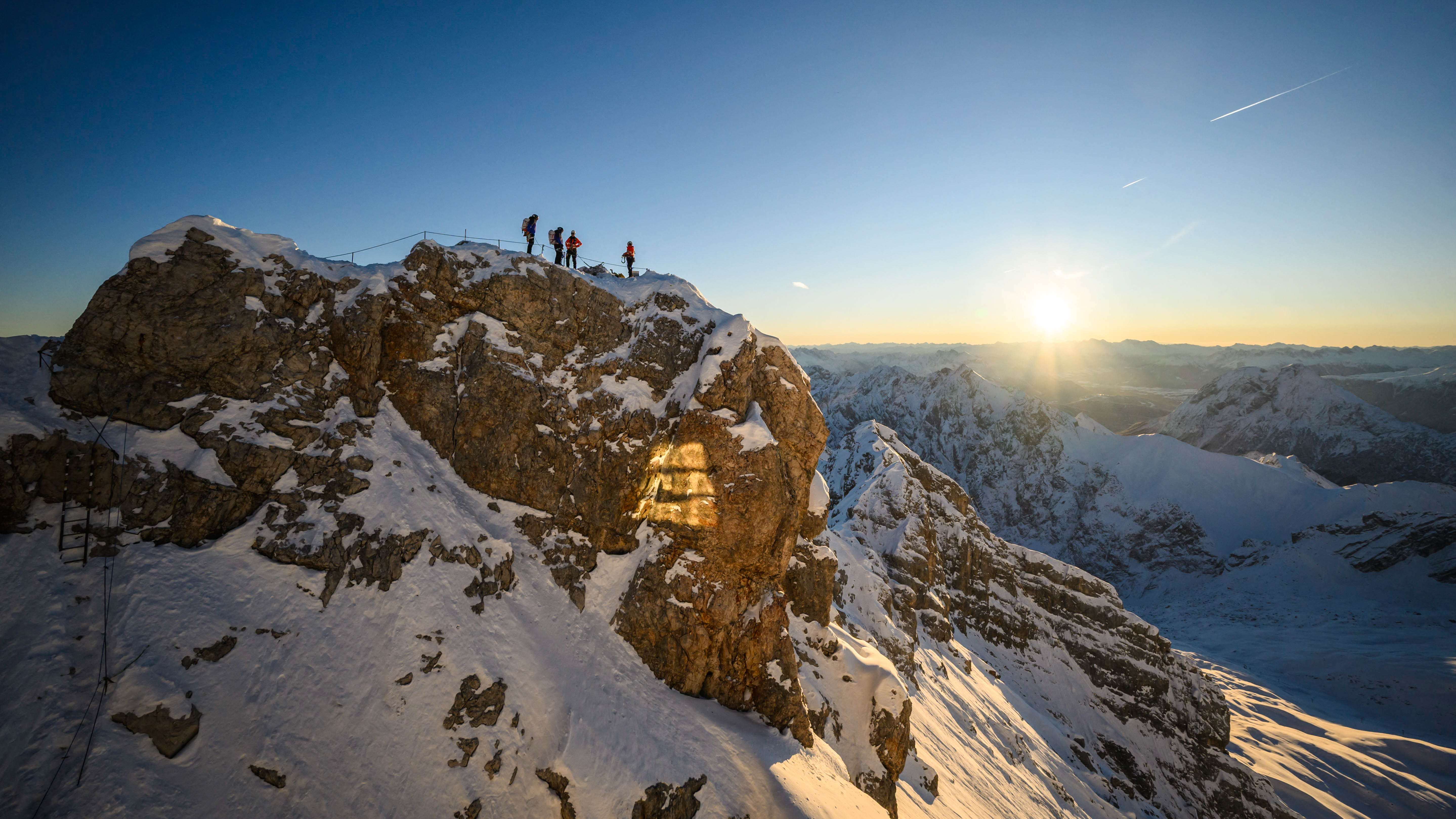 Workers prepare the site for the arrival of the golden summit cross after its refurbishment on the top of  the Zugspitze (2962m) mountain near Grainau and Garmisch-Partenkirchen, southern Germany, on November 28, 2025.  (Photo by Philipp Guelland / AFP via Getty Images)