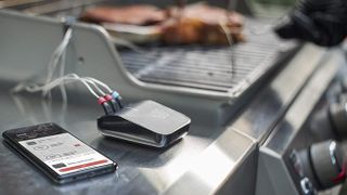 Weber Connect Smart Grilling Hub on top of an outdoor barbeque grill
