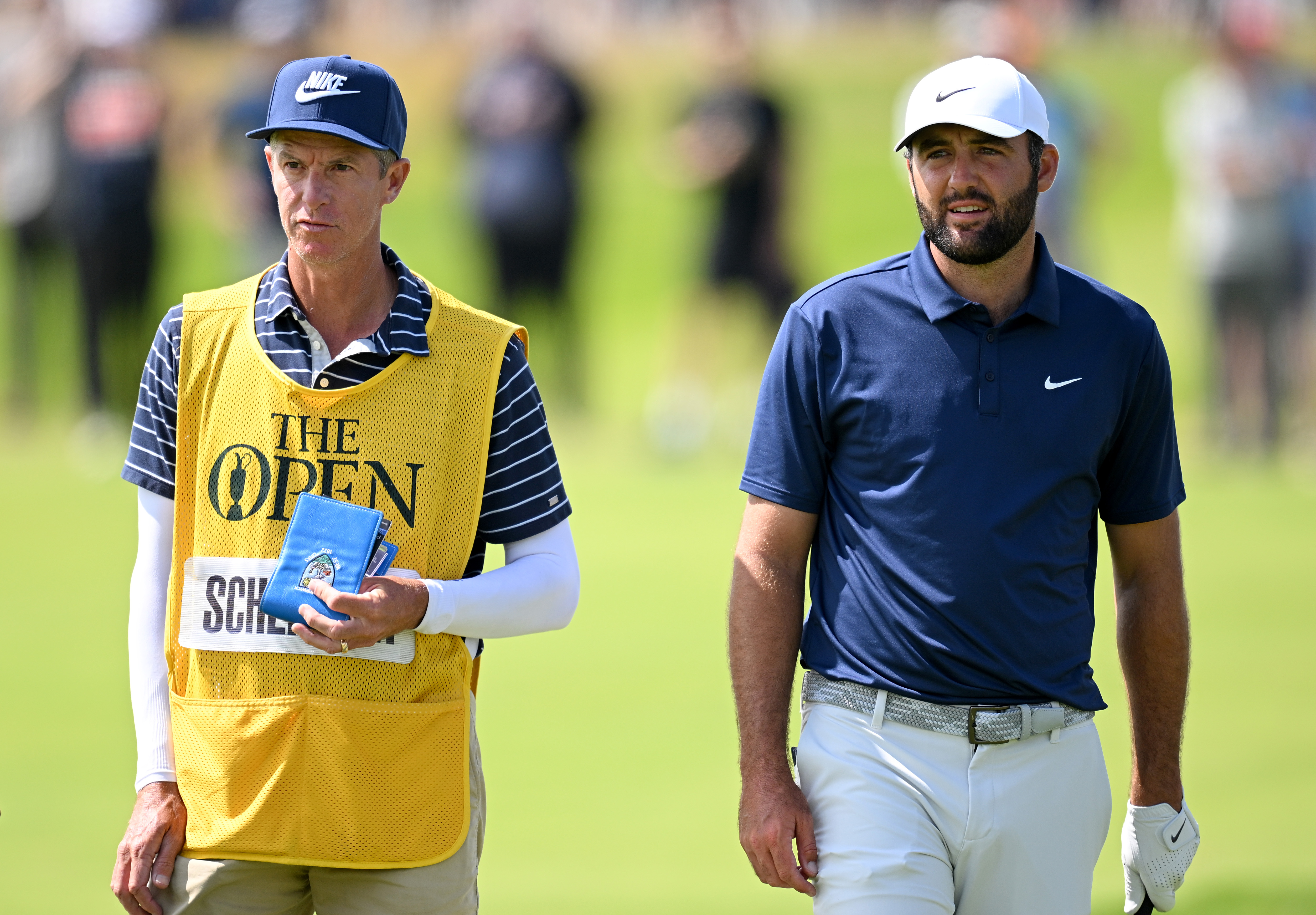 Scottie Scheffler chats to his caddie Ted Scott