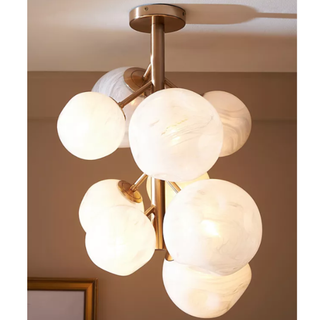 Marbled glass statement chandelier reminiscent of clouds in the sky.