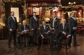 (L-R): Dean Wicks, Phil Mitchell, Keanu Taylor, Nish Panesar, Jack Branning, Rocky Cotton and Ravi Gulati sitting in the Vic in EastEnders 