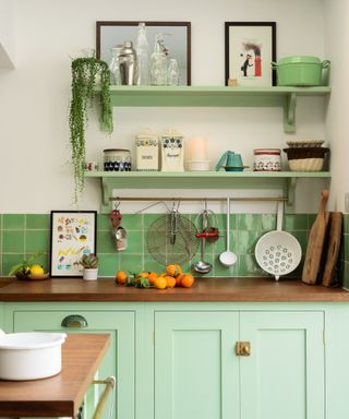 Green painted kitchen by deVOL