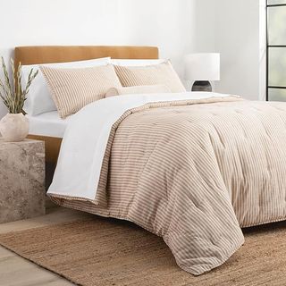 beige and white striped bedding
