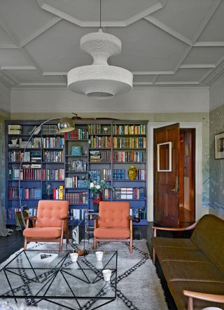 Elegant living room with floor to ceiling bookshelves