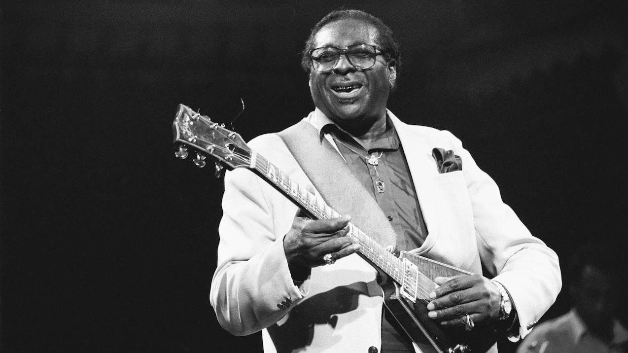 Albert King onstage playing guitar