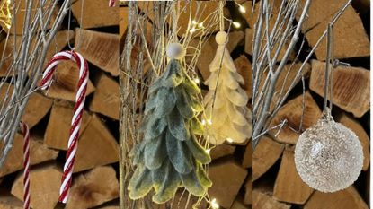 A selection of the best christmas tree decorations in front of a log stack