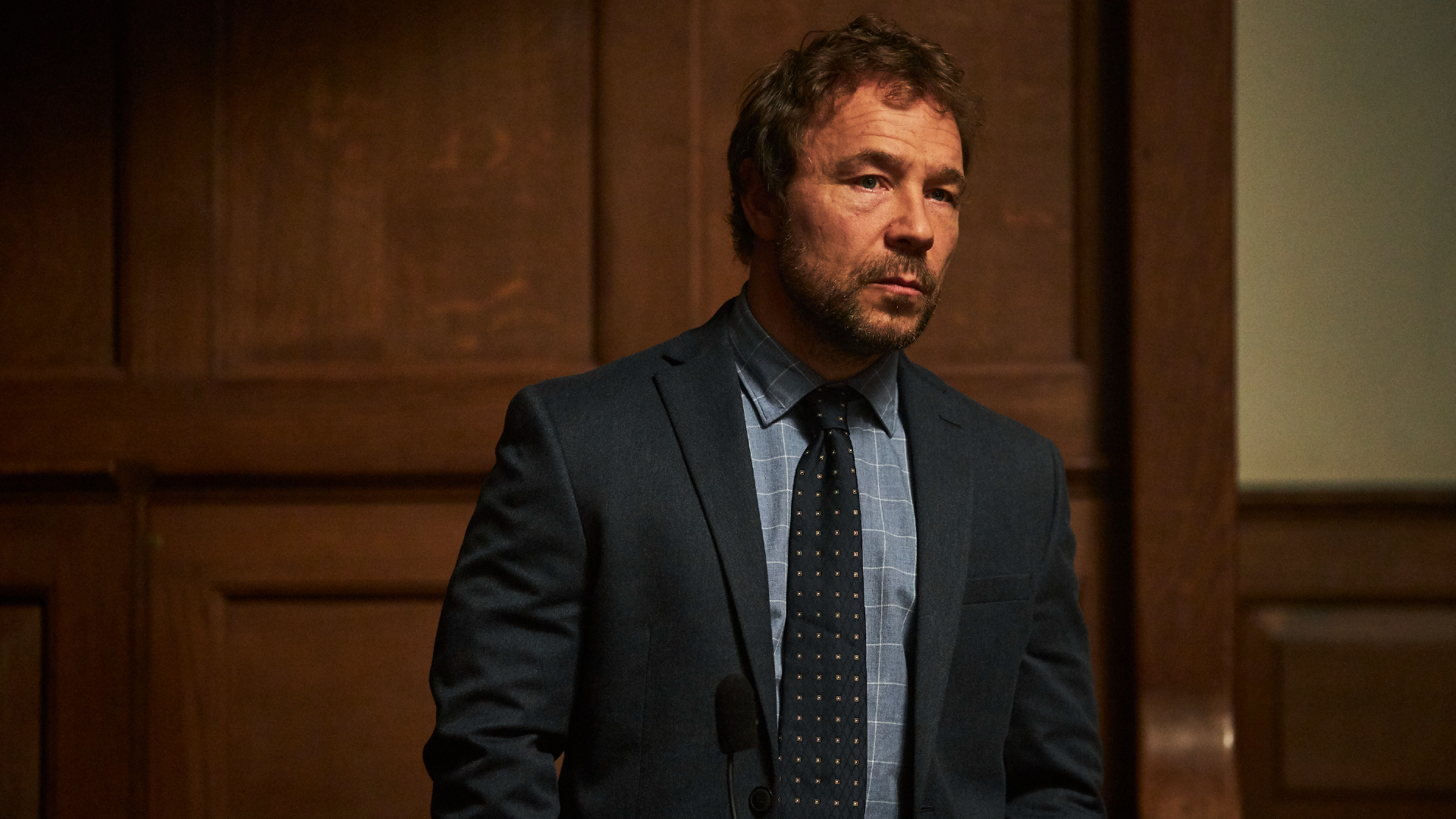 Matthew Collins (Stephen Graham) suited and booted for court in The Walk-In.