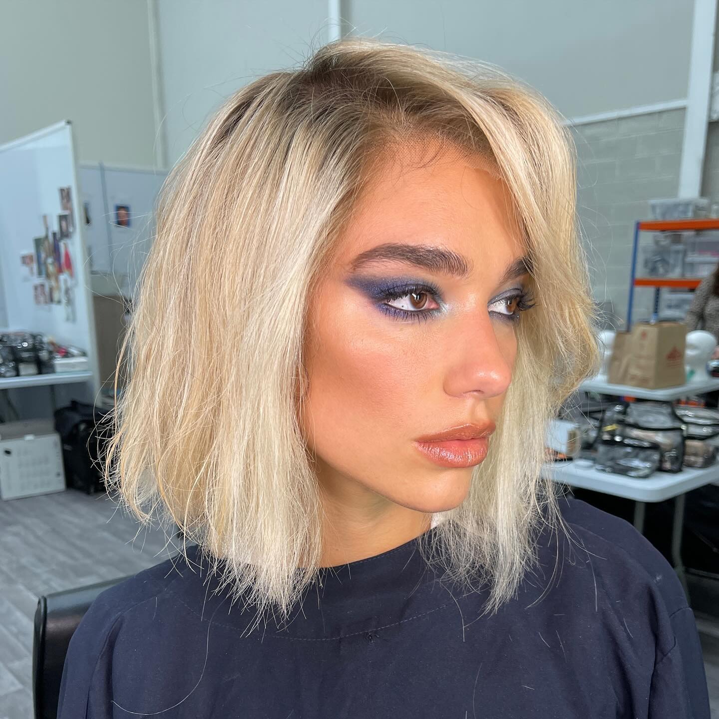 Photo of Dua Lipa wearing denim eye shadow