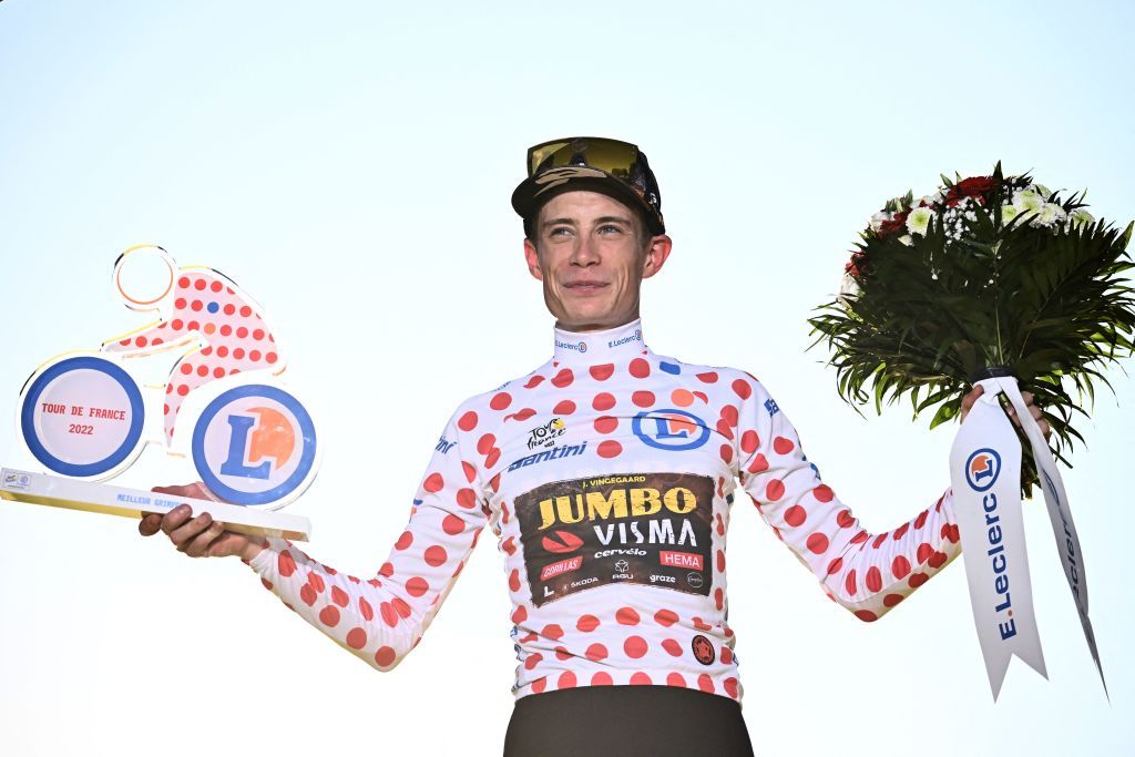JumboVisma teams Danish rider Jonas Vingegaard celebrates on the podium with the climbers dotted jersey after the 21st and final stage of the 109th edition of the Tour de France cycling race 1156 km between La Defense Arena in Nanterre outside Paris and the ChampsElysees in Paris France on July 24 2022 Photo by Marco BERTORELLO AFP Photo by MARCO BERTORELLOAFP via Getty Images