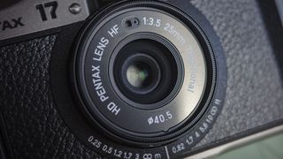 Closeup of the Pentax 17 compact film camera's lens