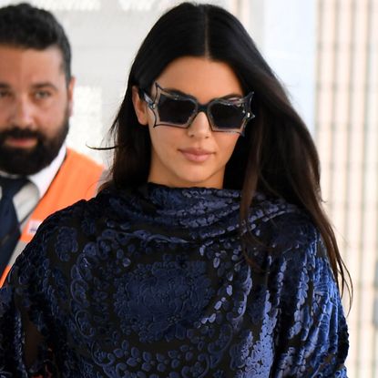 Kendall Jenner styled a poncho as a going-out top with the dark denim trend and ballet flats in Venice