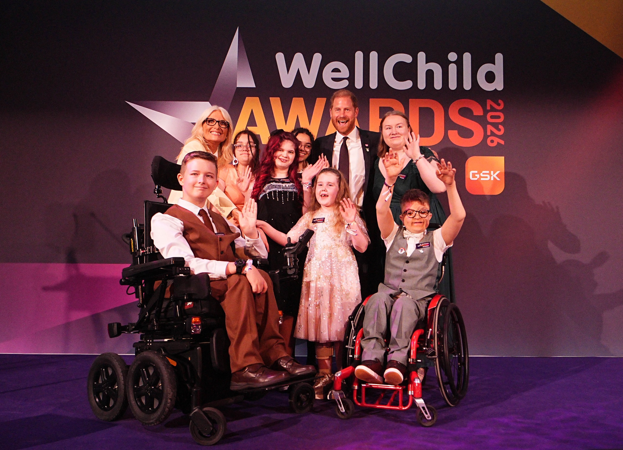 Prince Harry posing with WellChild Awards winners