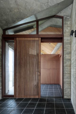 entrance door of japanese house in timber and concrete