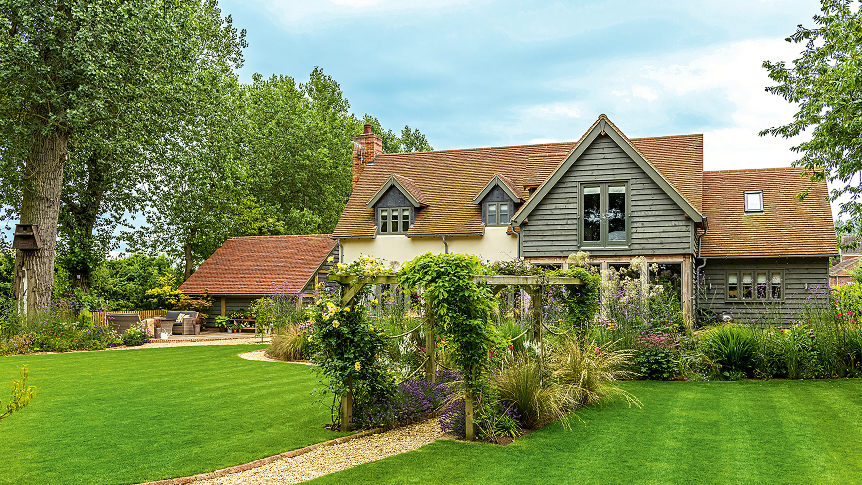 new oak frame self build with landscaped garden