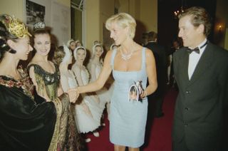 Princess Diana (1961 - 1997) meets members of the cast of an English National Ballet production of 'Swan Lake', at the Royal Albert Hall, London, 3rd June 1997