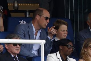 Prince William and Prince George watching cricket