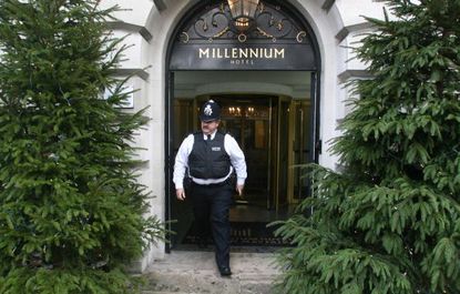 A policeman leaves the Millennium Hotel