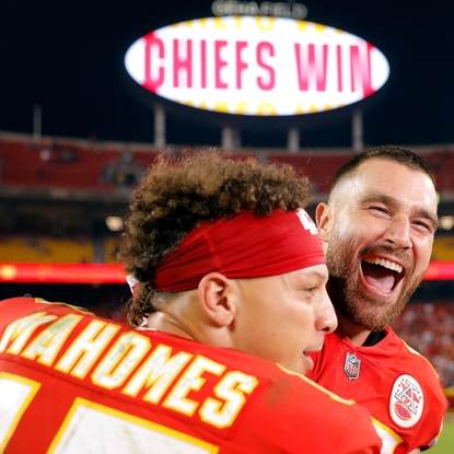 Patrick Mahomes #15 and Travis Kelce #87 of the Kansas City Chiefs celebrate after the Chiefs defeated the Las Vegas Raiders 30-29 to win the game at Arrowhead Stadium on October 10, 2022 in Kansas City, Missouri.